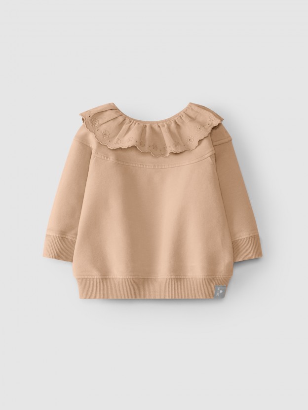 Pull en peluche avec broderie anglaise