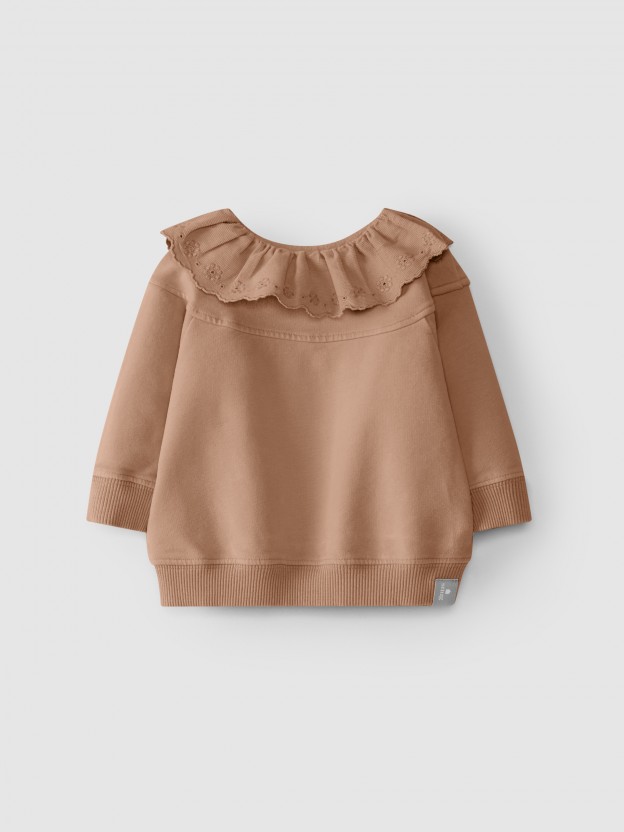 Pull en peluche avec broderie anglaise