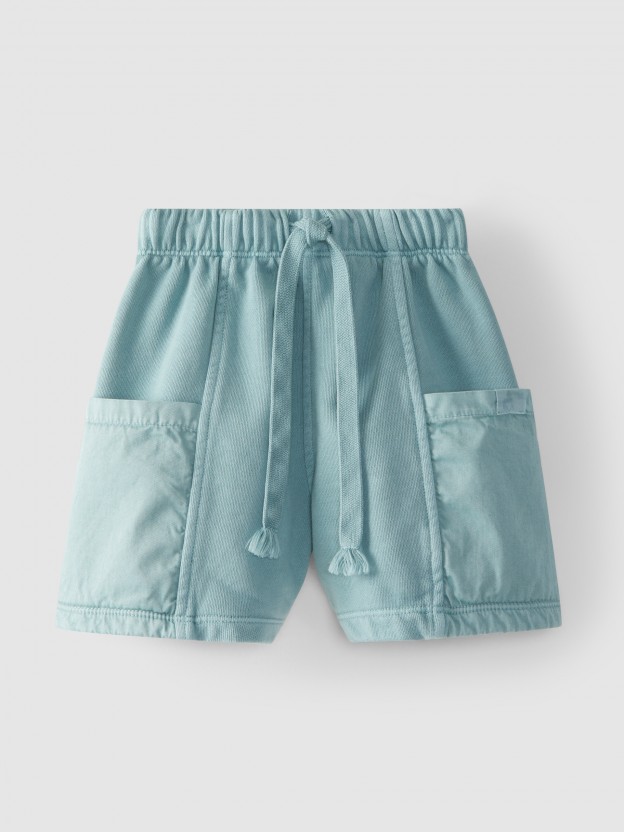 Pantalones cortos en felpa con bolsillos de tela