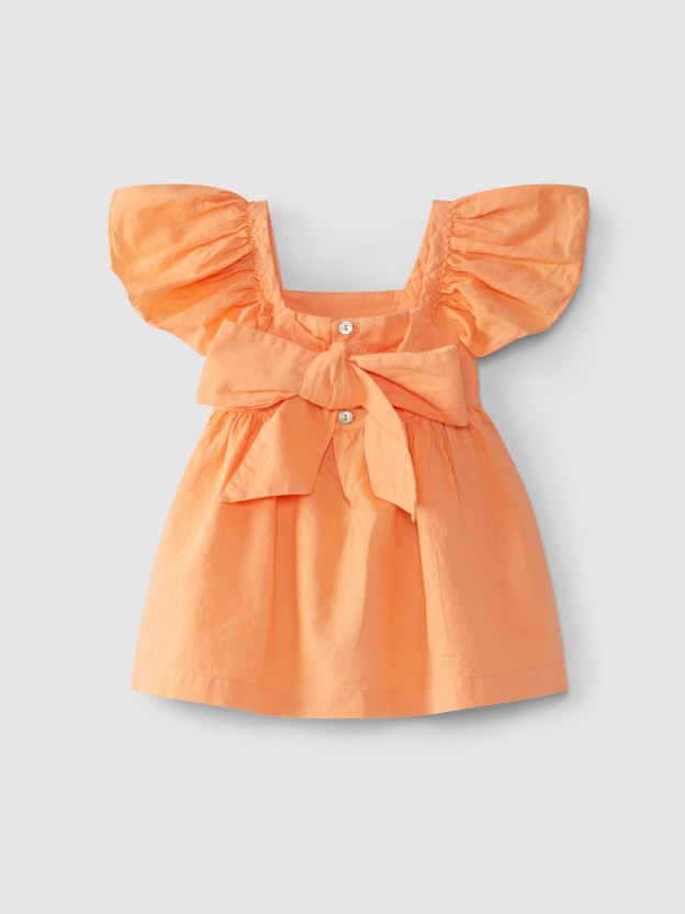 Dress with bow and rickrack