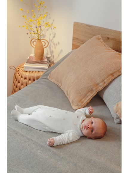 Babygrow embossed stripes with decorative buttons on the front