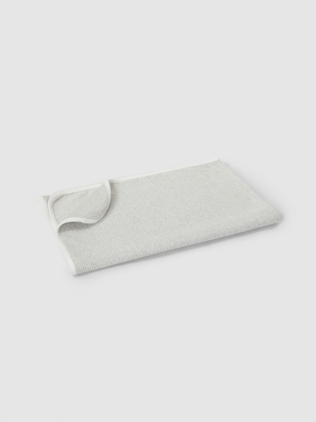 Baby wrap in pied-de-poule jacquard knit