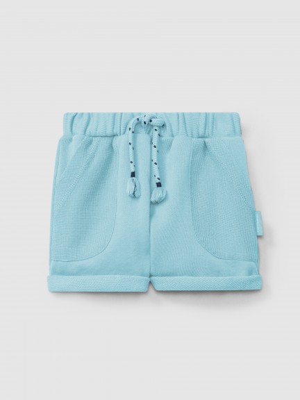 Pantaln corto pull-up en felpa con bolsillos en punto gofre