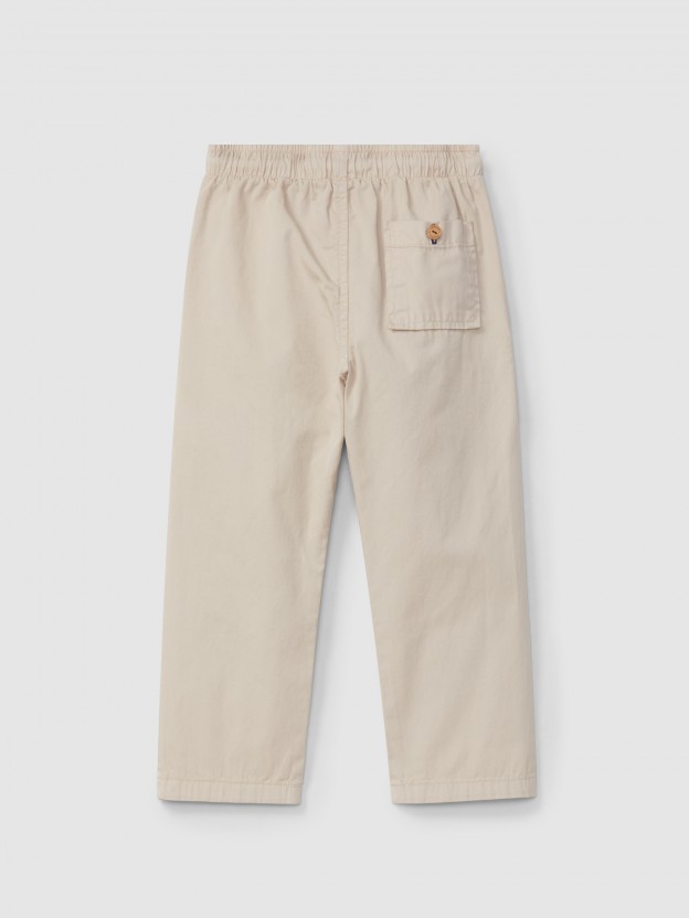 Calas pull-up lisas em sarja com trs bolsos
