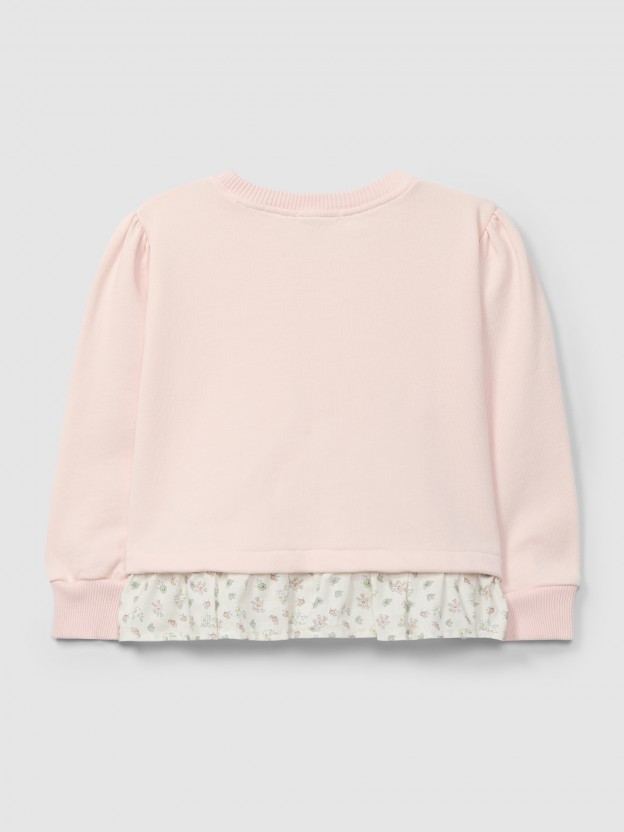 Plush sweater with ruffled detail in printed fabric