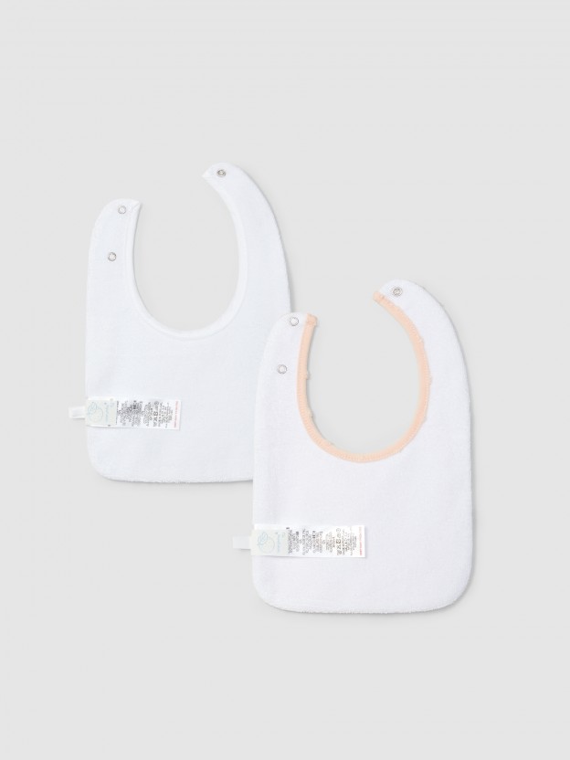 Pack-of-two ribbed bibs with embossed polka dots Pack-of-two ribbed bibs with embossed polka dots