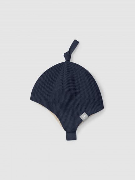 Gorro em malha waffle com interior de pelo