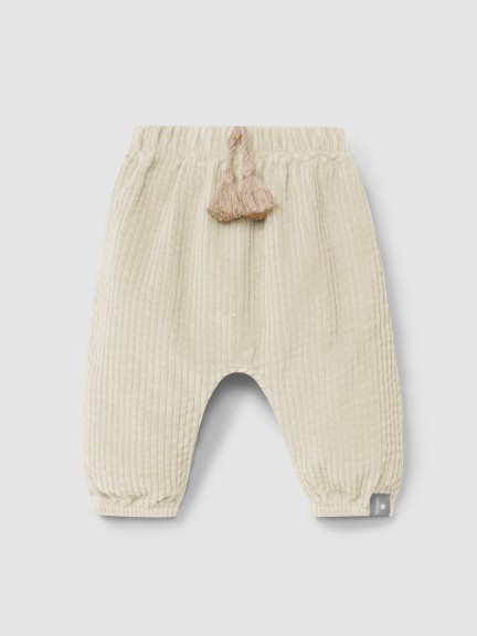 Calas pull-up em veludo canelado e detalhe de cordo com pom-pom