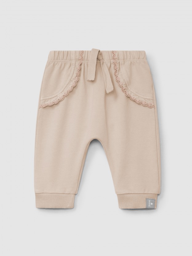 Calas pull-up em felpa com folho bordado