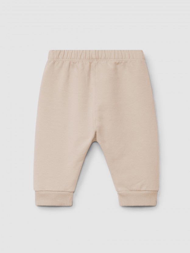 Calas pull-up em felpa com folho bordado