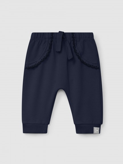 Pantaln pull-up de felpa con volante bordado