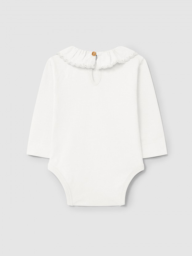 Bodysuit in organic cotton with ruffled embroidered collar