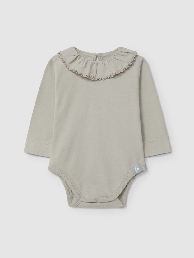 Bodysuit in organic cotton with ruffled embroidered collar