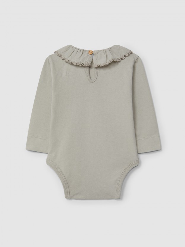 Bodysuit in organic cotton with ruffled embroidered collar