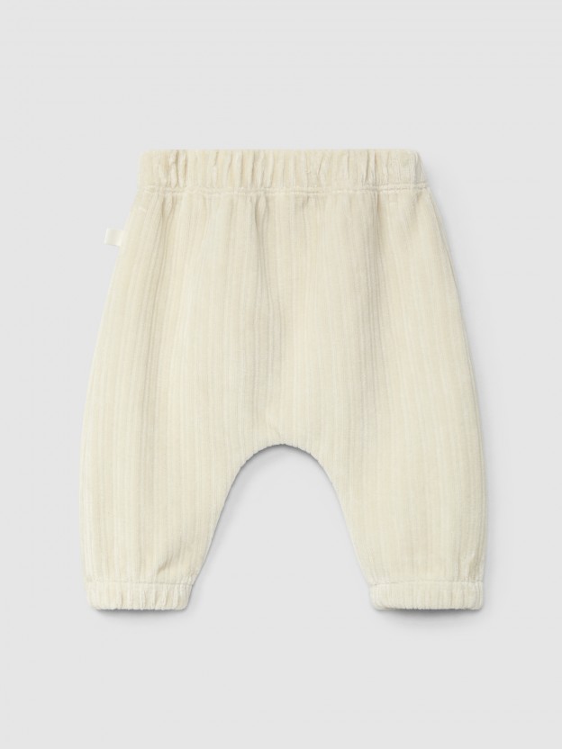 Pull-up pants in ribbed velvet with pocket
