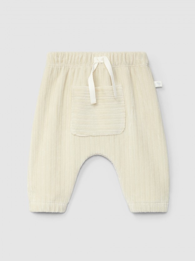 Pull-up pants in ribbed velvet with pocket