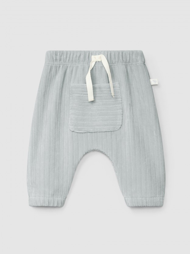 Pull-up pants in ribbed velvet with pocket