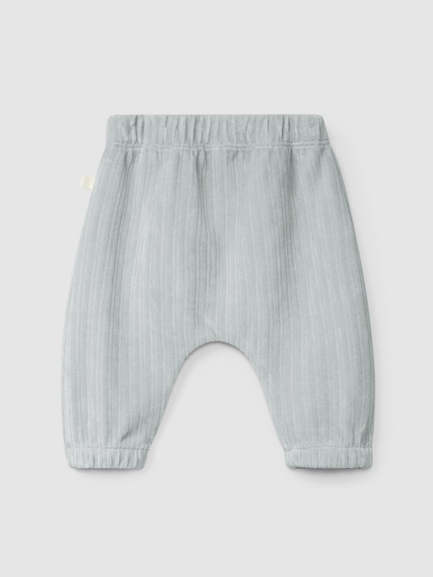 Pull-up pants in ribbed velvet with pocket