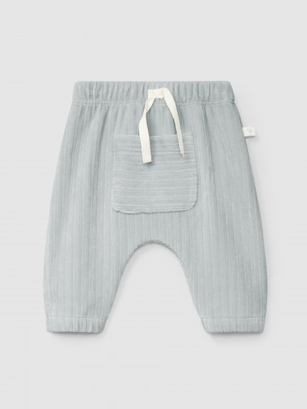 Pull-up pants in ribbed velvet with pocket