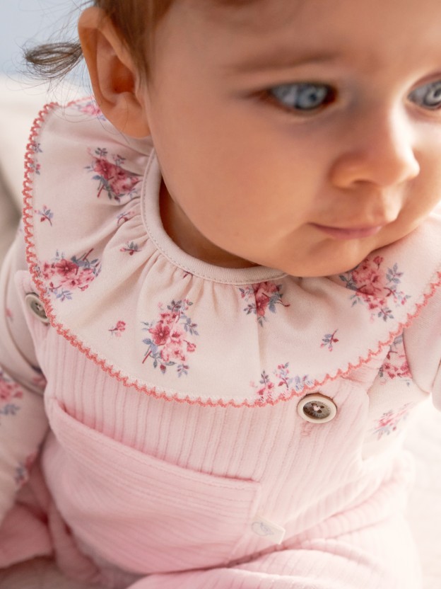 Floral print bodysuit with ruffled detail