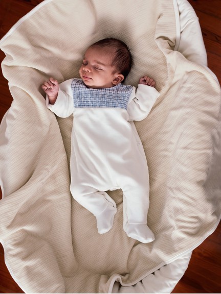 Velvet babygrow with smocking detail